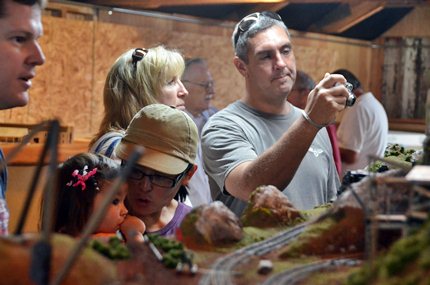 people enjoying a model layout