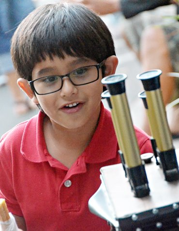 child looking at an exhibit